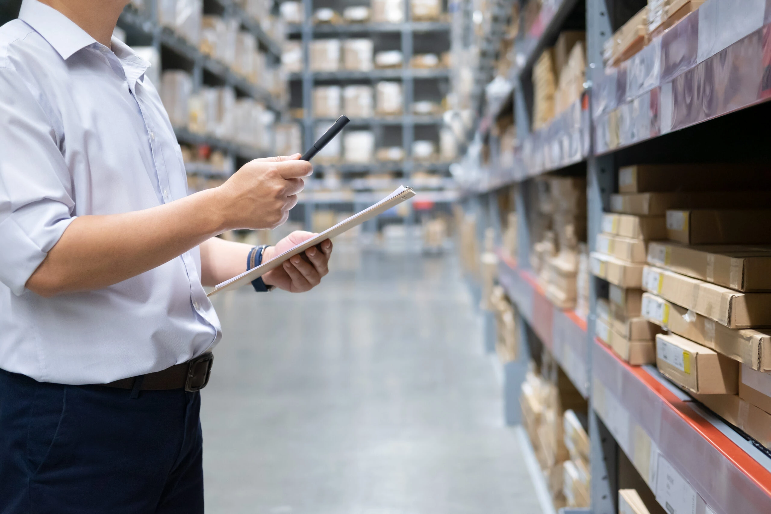 Man warehouse worker checking goods